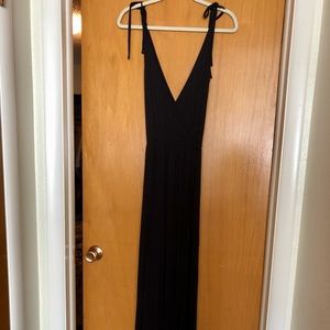 Wrap style black maxi dress with adjustable tie straps. Size small.